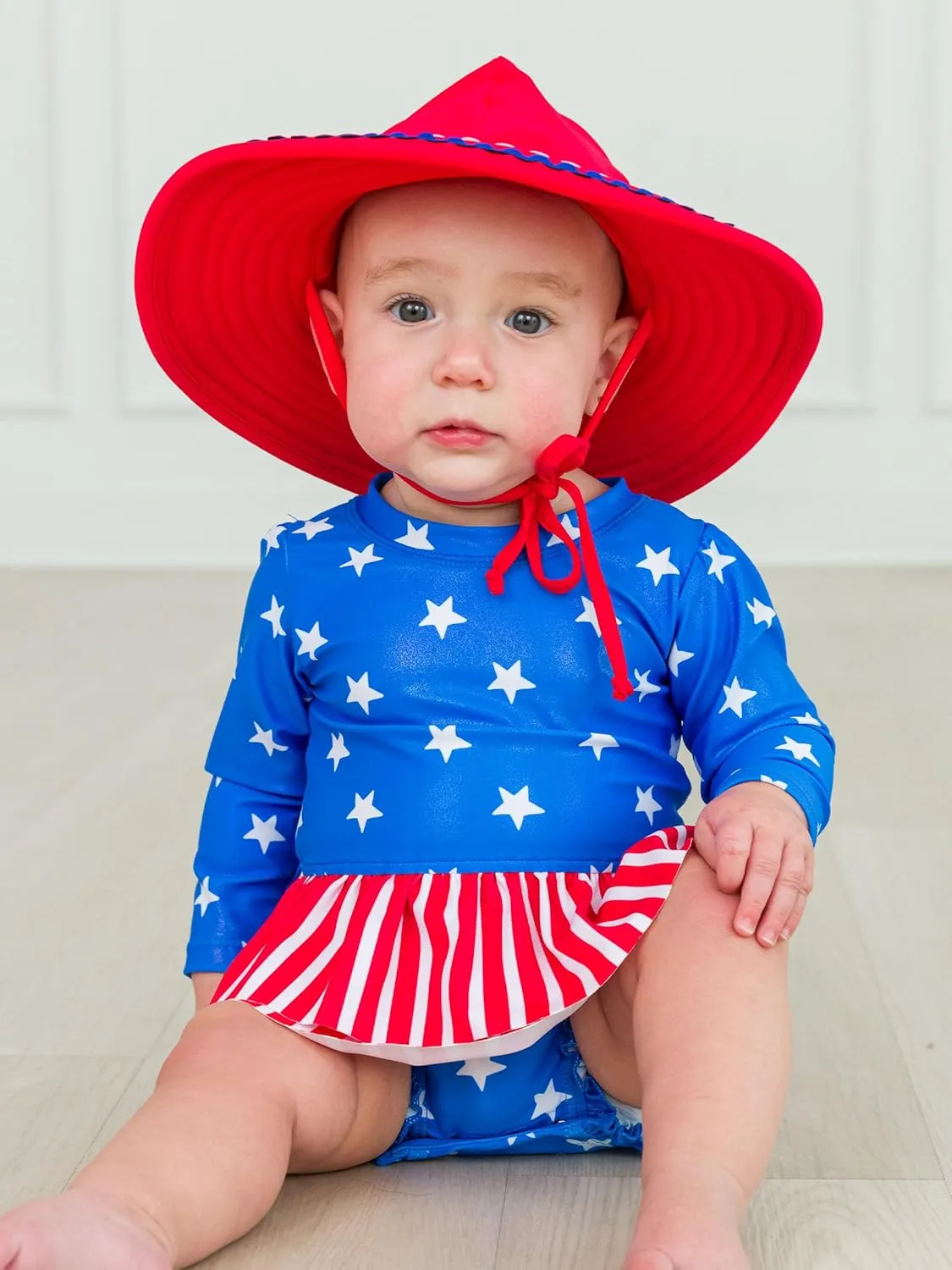 RuffleButts Baby Girls UPF 50  Sun Protection Tulle Skirted Long Sleeve One Piece Rash Guard Swimsuit