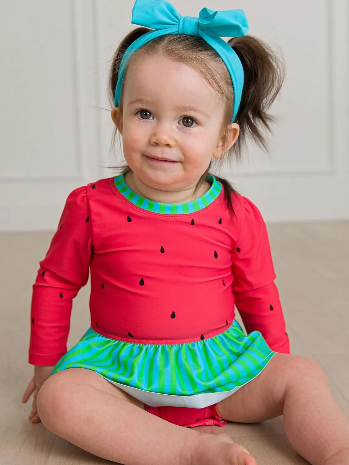 RuffleButts Baby Girls UPF 50  Sun Protection Tulle Skirted Long Sleeve One Piece Rash Guard Swimsuit